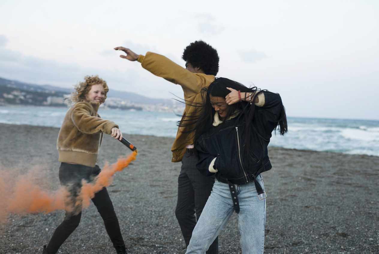 Friends celebrating on beach